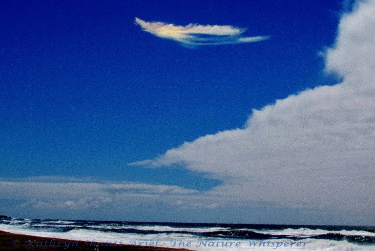 Rainbowl Angel above ocean