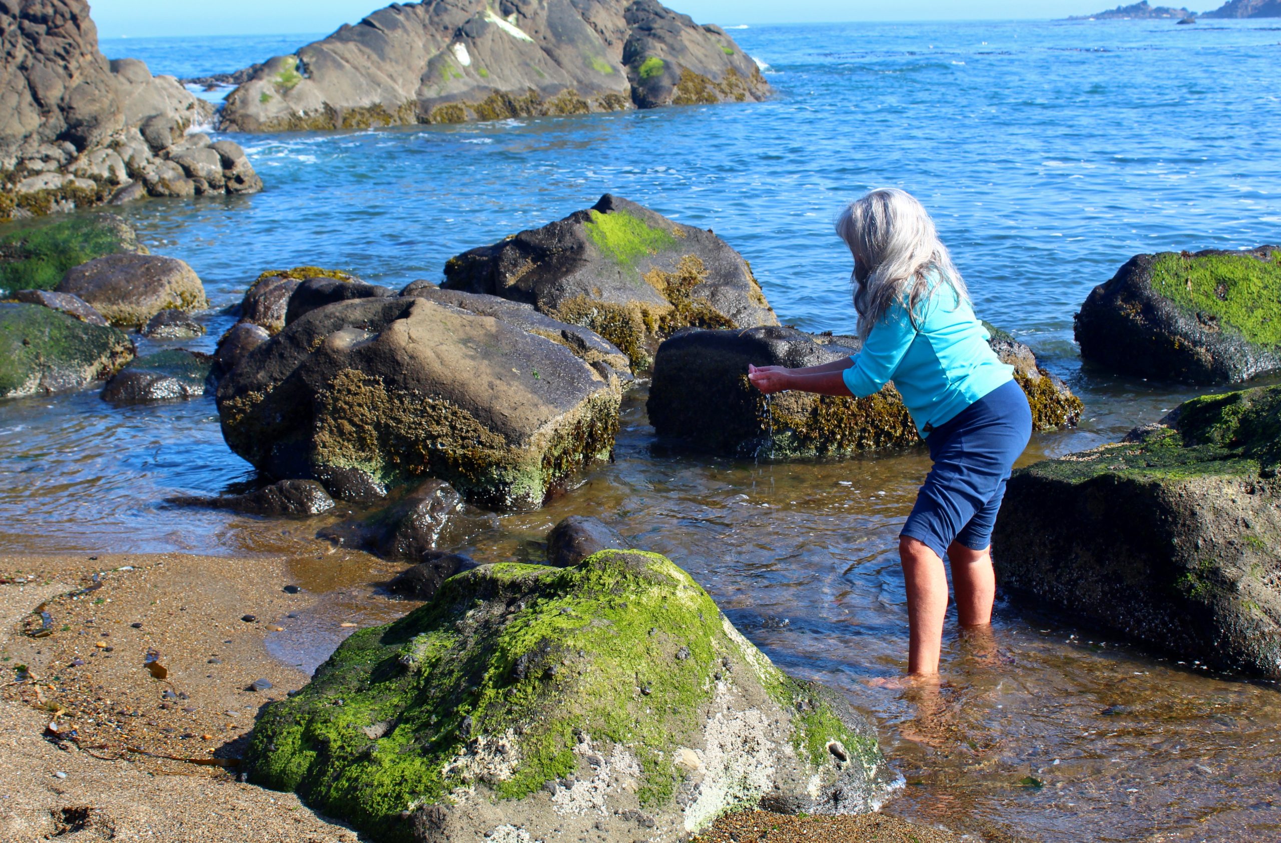 Emmaray doing a water blessing on the Oregon coast